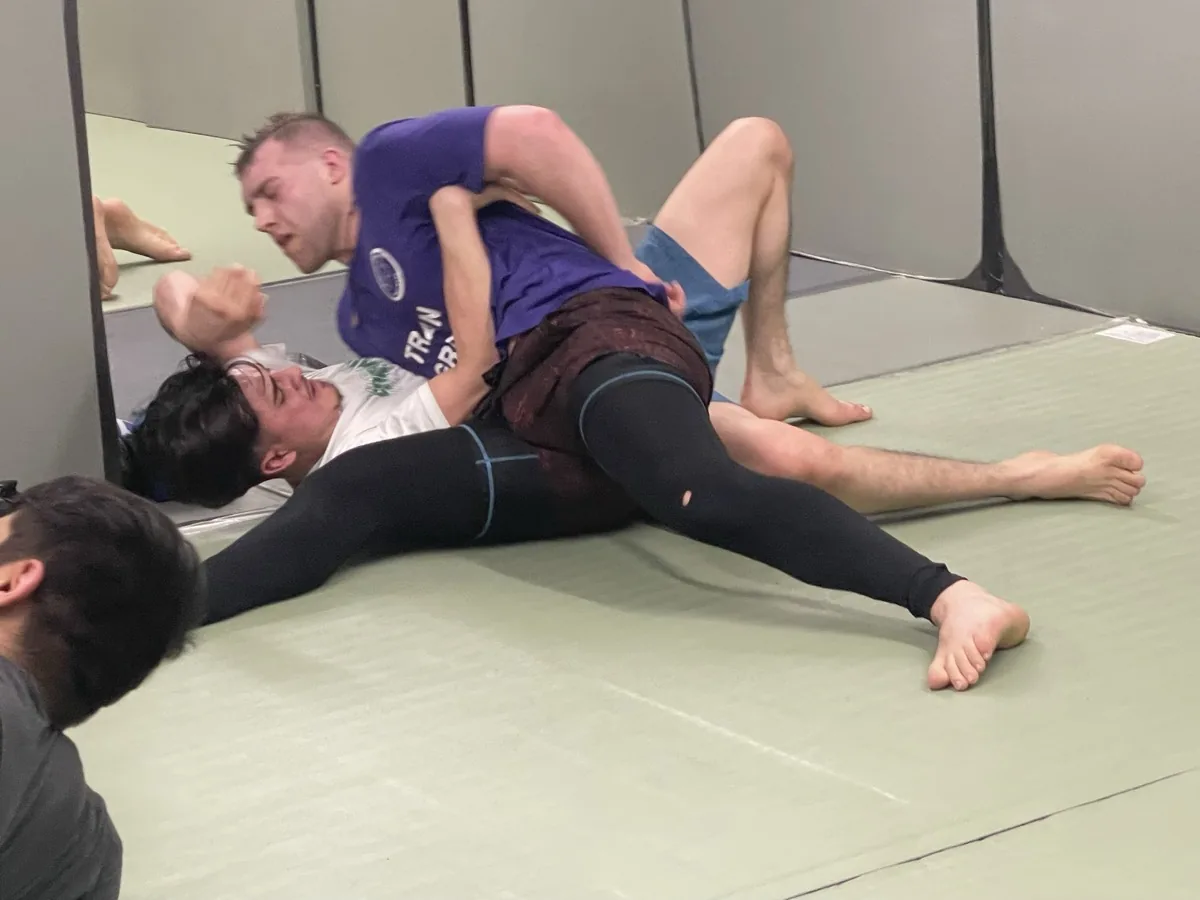 Two students grappling on the ground during ground self-defense training at SD4ALL, Cedar Knolls NJ